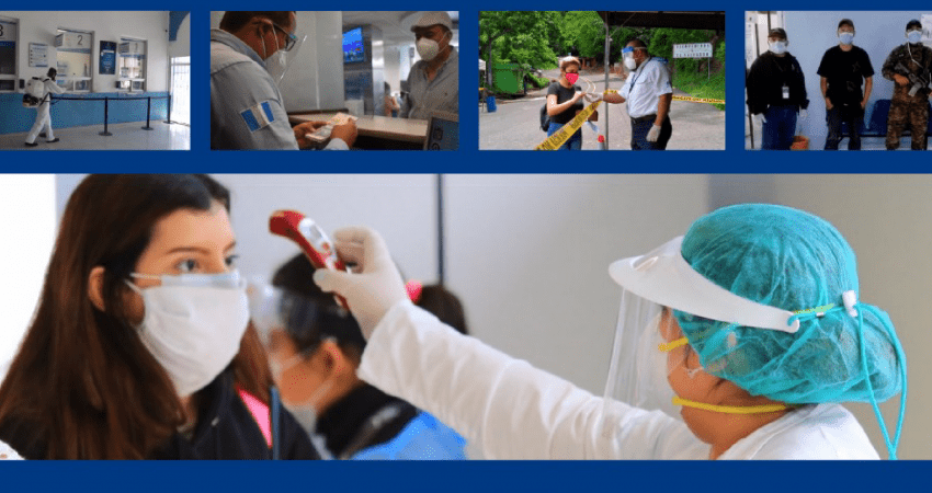 Imagen de archivo de fronteras y personal de salud midiendo la temperatura de otra
